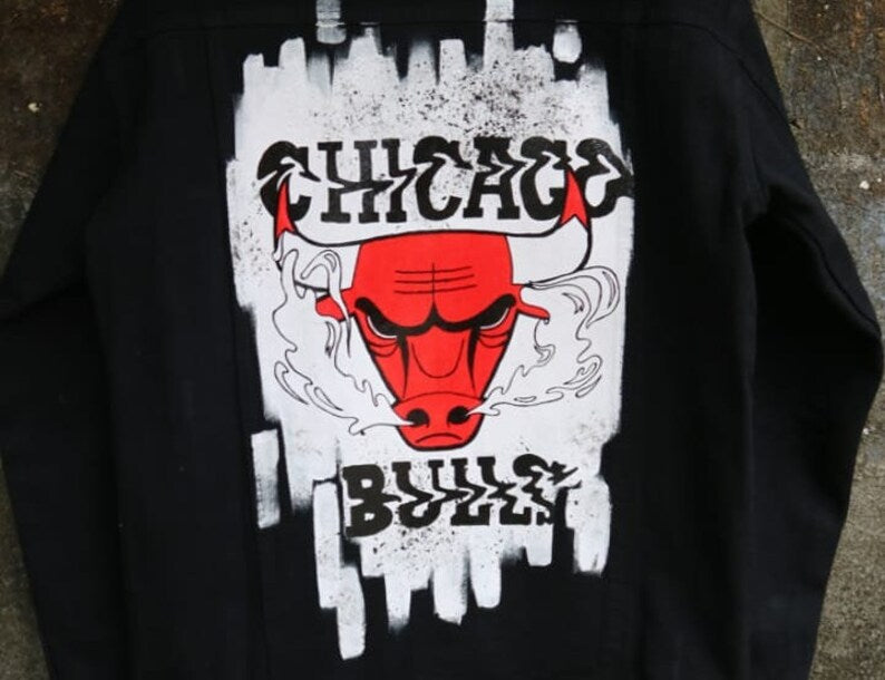 Chicago Bulls Custom Denim Jacket Black with a red bull logo and 'Bulls Chicago' text on a textured surface