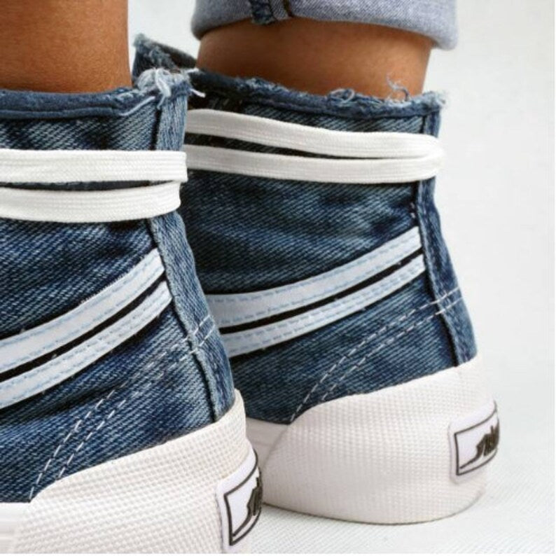 Close-up of denim high-top sneakers with white soles and stripes Casual Footwear