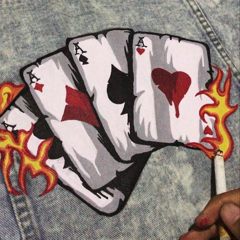 Korean Style Four playing card patches with flaming edges on a denim background