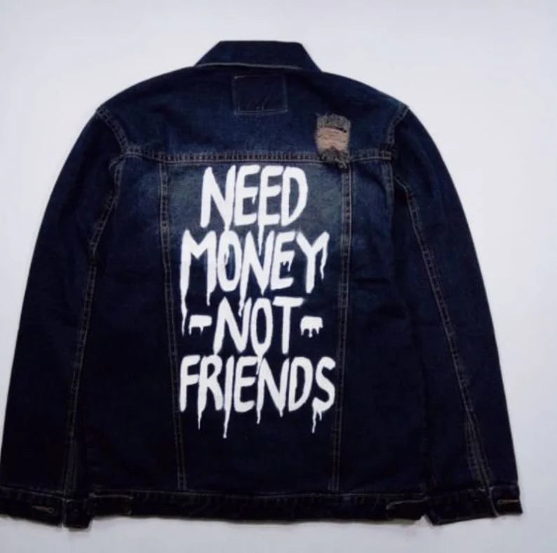 Denim jacket with 'NEED MONEY NOT FRIENDS' text on a white background