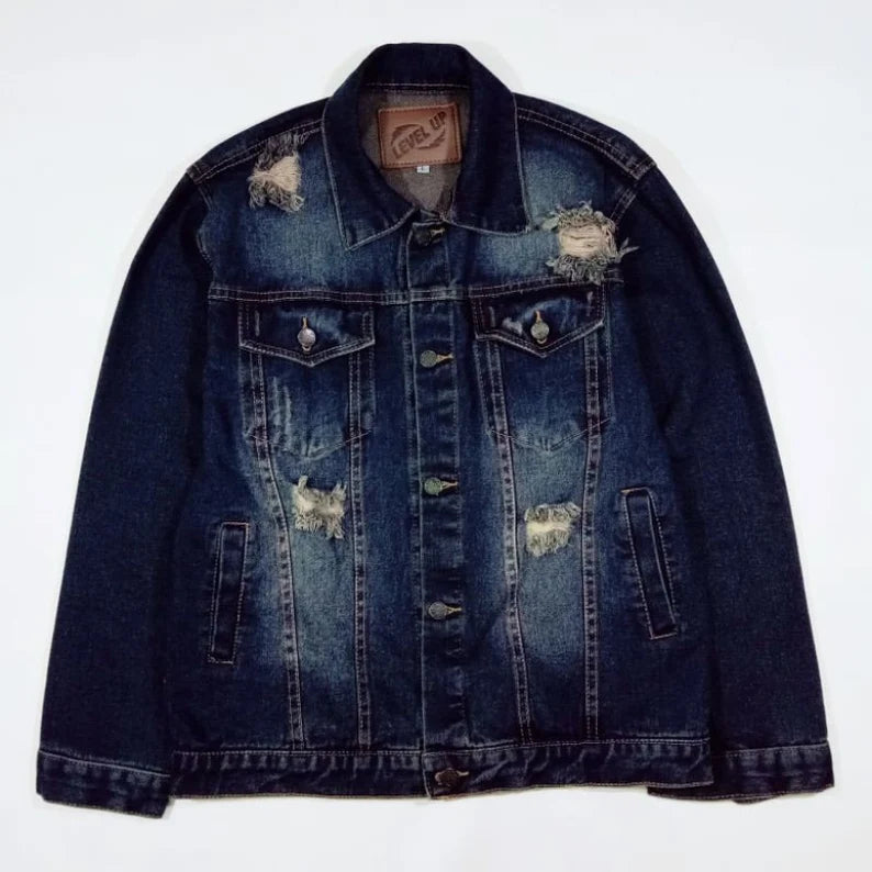 Denim jacket with distressed details on a white background