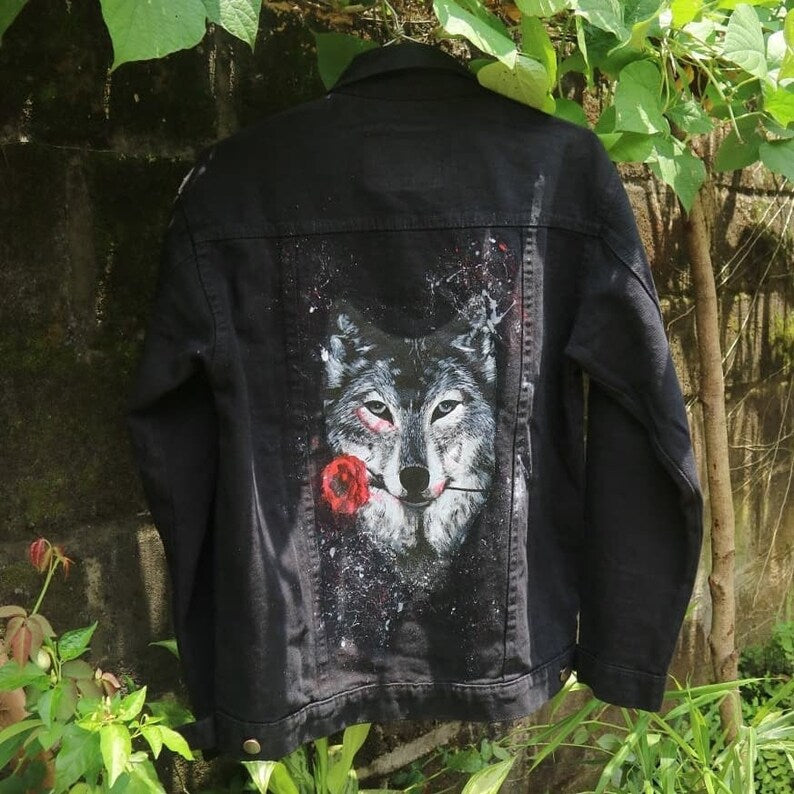Halloween Outfits Black denim jacket with a wolf and flower design in a natural setting