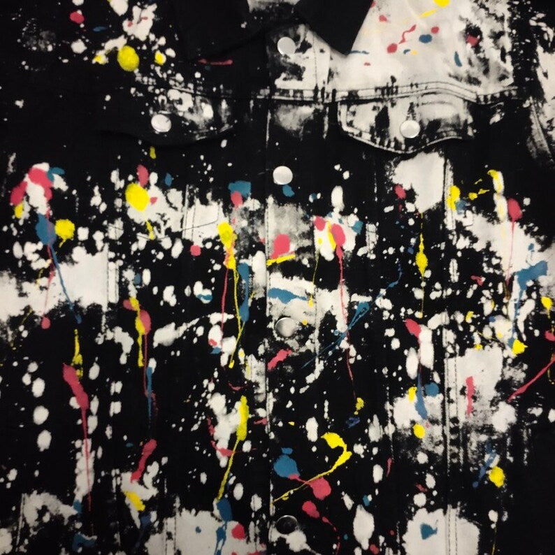 soft grunge style Denim jacket with colorful paint splatter design on a black background