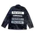 black hand-painted denim jacket with 'Never Surrender' and 'Stop Racism' street art typography