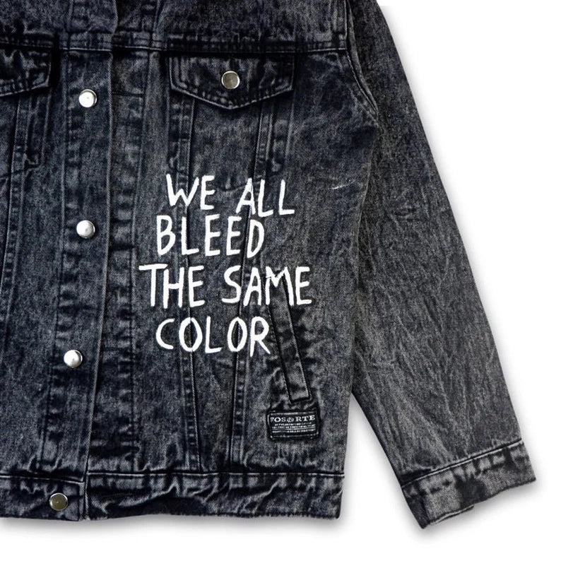 Anti-Racism Denim jacket with text 'We all bleed the same color' on a white background