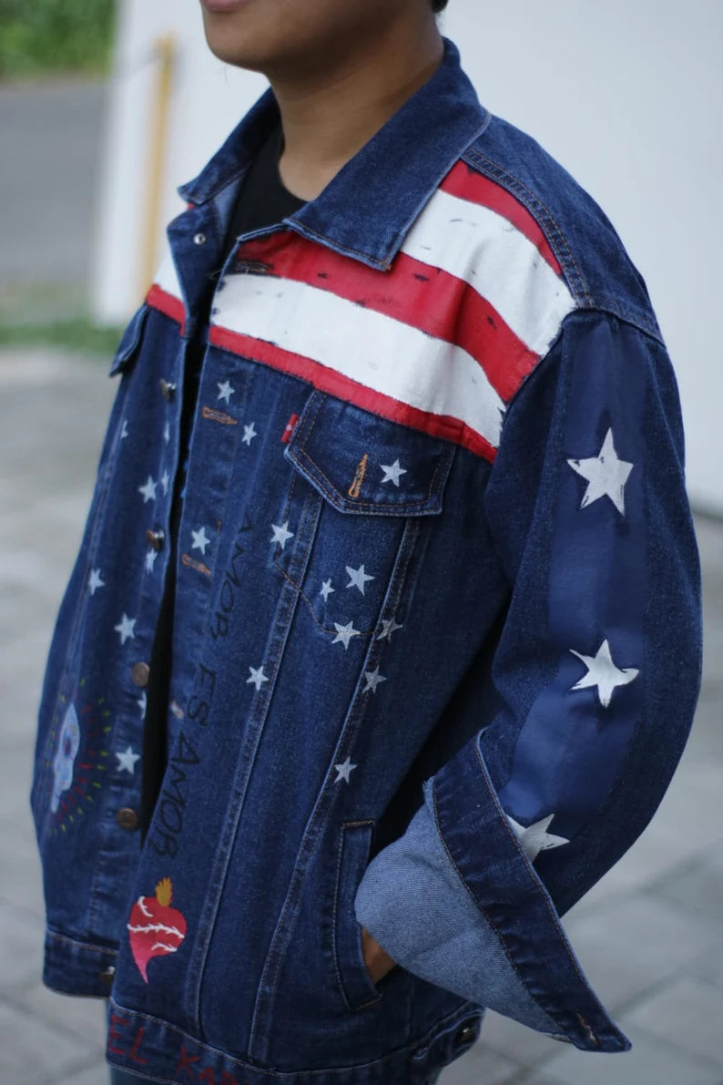 Doctor Strange Multiverse Denim jacket with American flag design worn by a person outdoors.