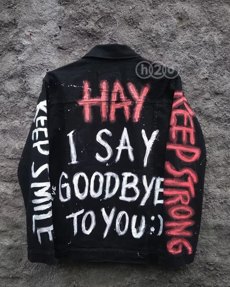 Ultimate Rock Lover’s Concert jacket with motivational phrases in red, white, and black on a textured gray background