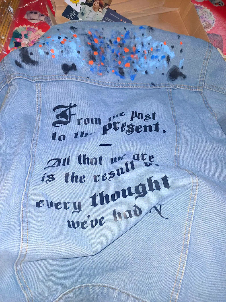 NCTZen Concert Outfit Ideas Denim jacket with text and paint splashes on a colorful background
