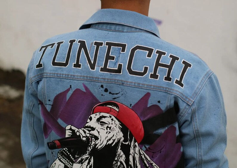 Denim jacket with 'TUNECHI' text and graphic design on the back. Hip Hop Concert Outfit
