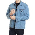 Person wearing a blue denim jacket on a white background