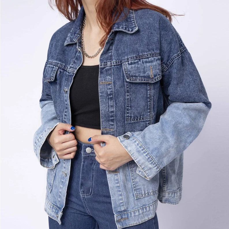 Person wearing a blue denim jacket on a white background