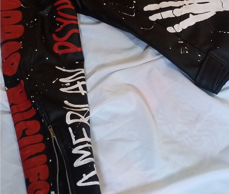 Black jacket with red and white text on a white background