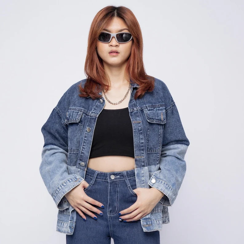 Person wearing a Denim Fusion Jacket and sunglasses against a white background