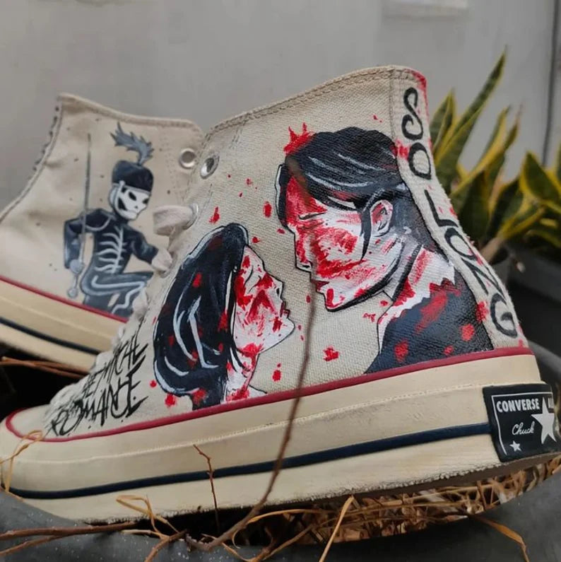 Converse shoe with My Chemical Romance design of a couple and skeleton, on a neutral background.