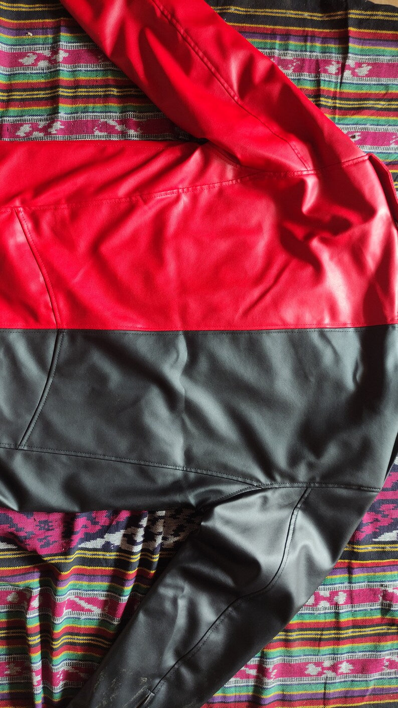 edgy outfit Red jacket on a colorful patterned fabric background