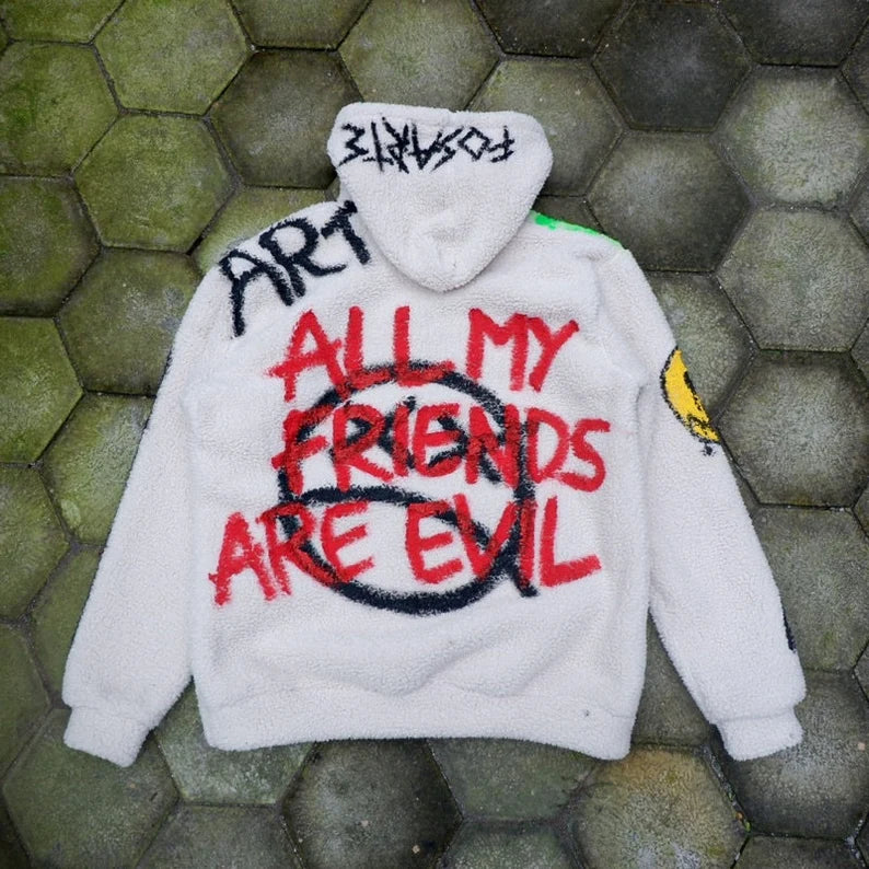 Custom Kaws Hoodie with text on a textured green and gray surface