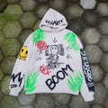 hand-painted KAWS companion hoodie with colorful graphics and text on a textured green and gray background