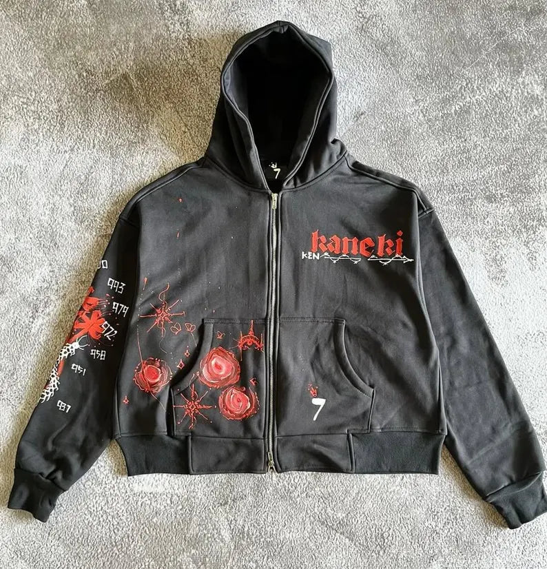 Anime Inspired Concert Outfit Black hoodie with red and white designs on a textured gray surface