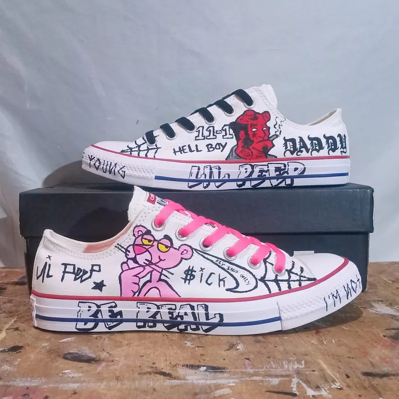 lil peep Painted sneakers with colorful graphics and text on a wooden surface
